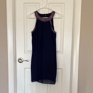 Elegant Navy Blue Sleeveless Dress with Embroidered Neckline